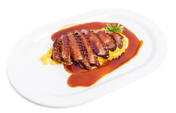 Grilled duck breast on mango puree. — Stock Photo, Image