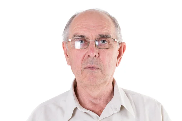 Old man in glasses looking in camera. Stock Image