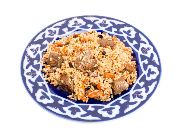 Fragrant pilaf with meat and dried apricots. — Stock Photo, Image