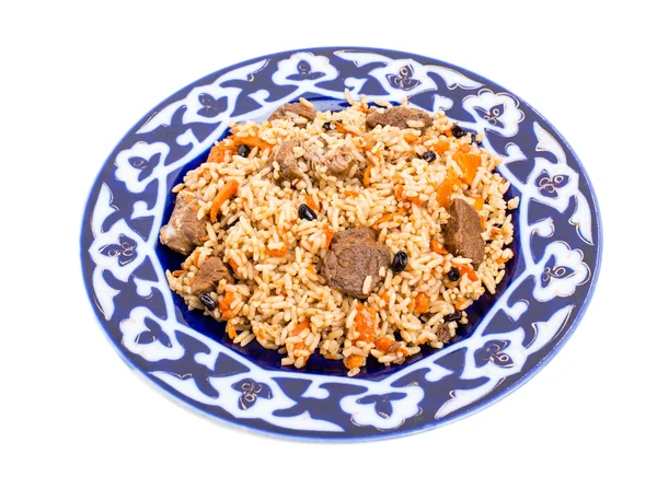 Fragrant pilaf with meat and dried apricots. — Stock Photo, Image