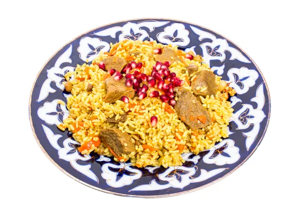 Fragrant pilaf with meat and dried apricots. — Stock Photo, Image