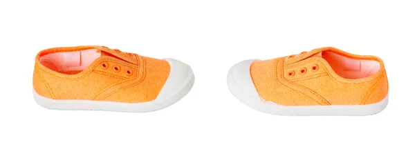 Bebé niña naranja zapatillas de tela . —  Fotos de Stock