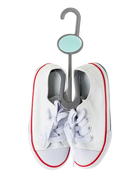 Wit canvas schoenen met rode strip. — Stockfoto