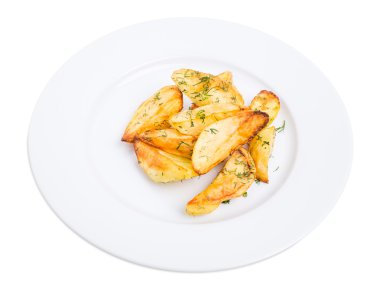 Patates dilimleri kıyılmış dereotu ile pişmiş.