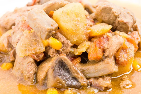 Stewed chicken liver with mushrooms and potatoes. — Stock Photo, Image