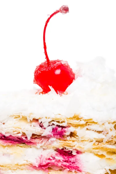 Delicious cake with cocktail cherry and coconuts. — Stock Photo, Image