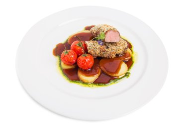 Ekmekli domuz filetosu domates confit ile.