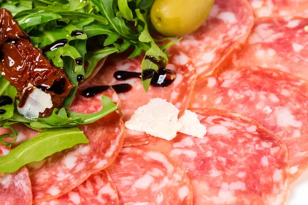 Italian salami and prosciutto with parmesan. — Stock Photo, Image