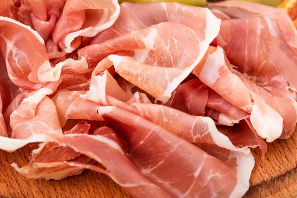 Delicious chopped prosciutto closeup. — Stock Photo, Image