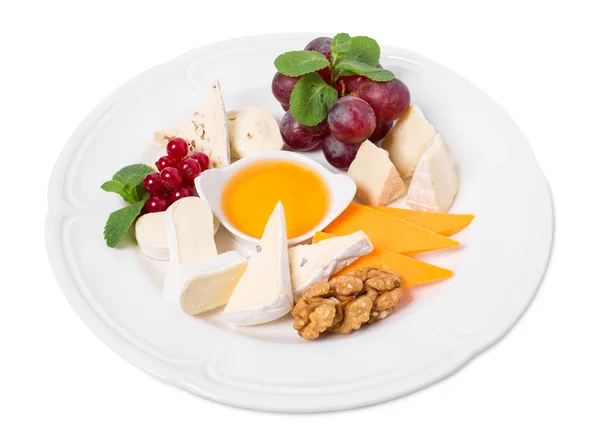 Delicious cheese platter with walnuts and honey. — Stock Photo, Image