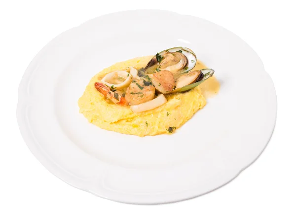 Delicious scallops and mussels with polenta. — Stock Photo, Image