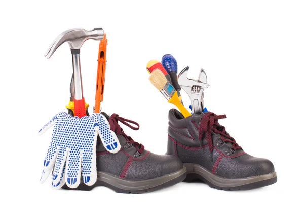 Working tools in boots. — Stock Photo, Image