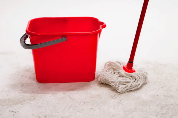 Red bucket with cleaning mop. — Stock Photo, Image