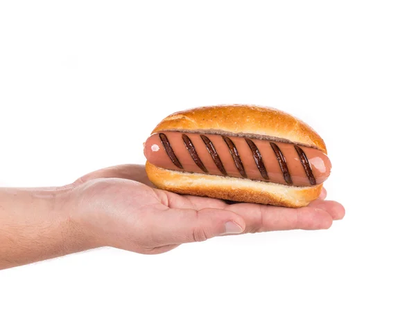 Grilled sausage roll in hand — Stock Photo, Image