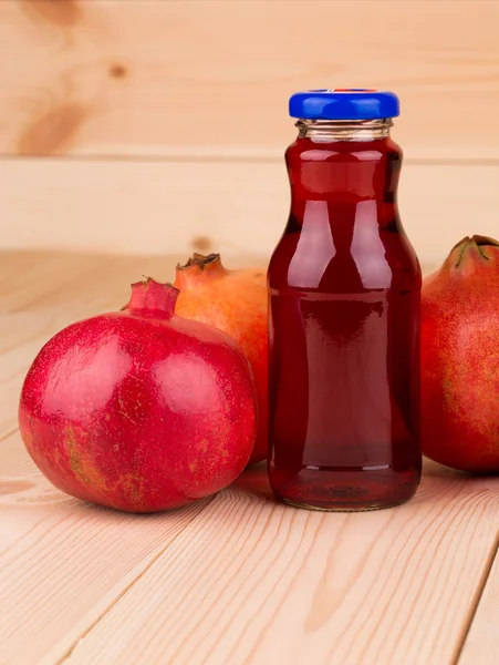 Bottle of pomegranate juice — Stock Photo, Image