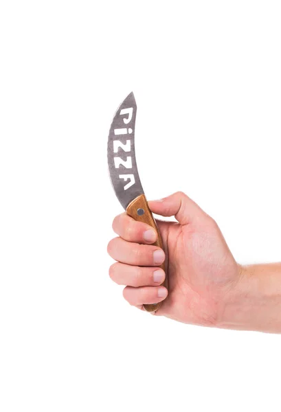 Hand holds pizza's knife. — Stock Photo, Image