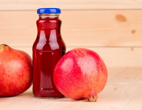 Bottle of pomegranate juice — Stock Photo, Image