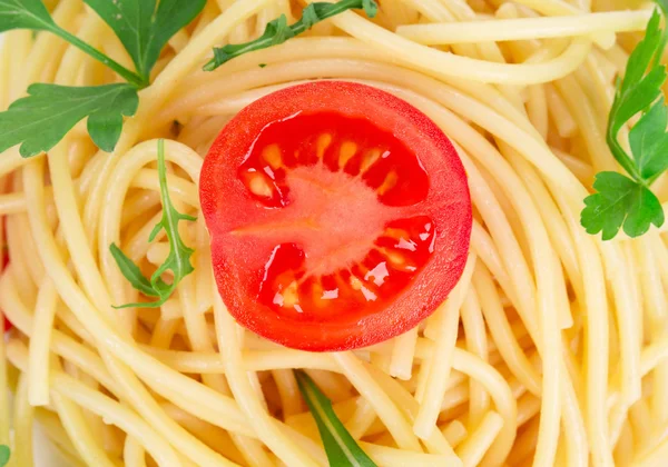 Italian pasta with basil and parsley. — Stock Photo, Image