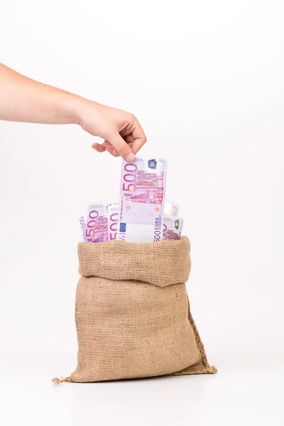 Hombre mano tomando el dinero euro factura de la bolsa . —  Fotos de Stock