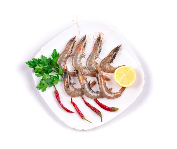 Raw tiger shrimps on plate. — Stock Photo, Image