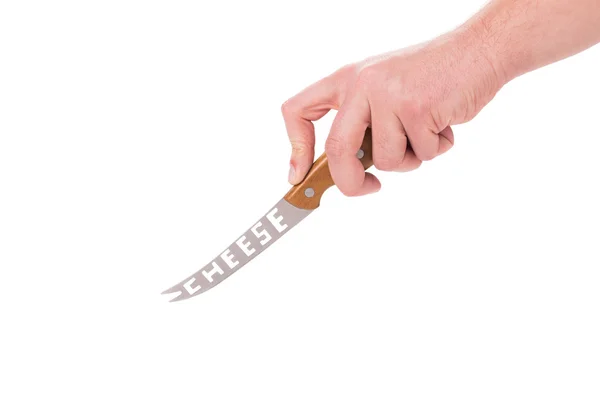 Hand holds cheese knife. — Stock Photo, Image