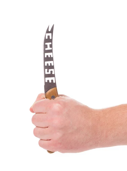 Hand holds cheese knife. — Stock Photo, Image