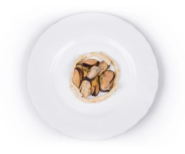 Tasty seafood on the round plate. — Stock Photo, Image