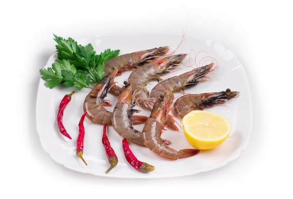Fresh shrimps on plate with pepper. — Stock Photo, Image