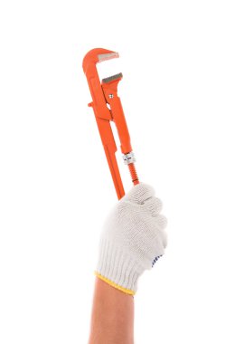 İngiliz anahtarını tutan el.