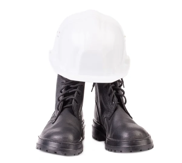 Hard hat and working boots. — Stock Photo, Image