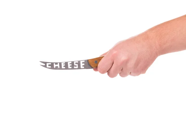 Hand holds cheese knife. — Stock Photo, Image