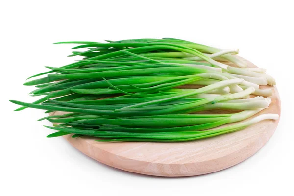 Spring onions on the wooden cutting board — Stock Photo, Image