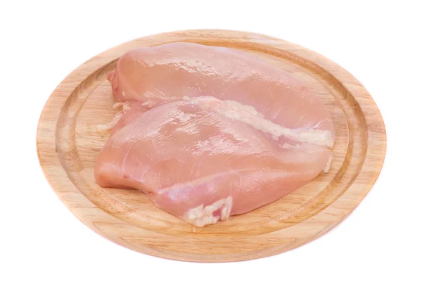 Poitrine de poulet crue sur la planche en bois — Photo