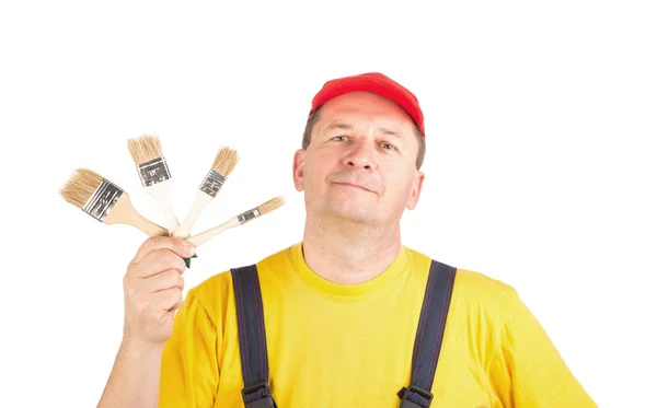 Worker showing brushes — Stock Photo, Image