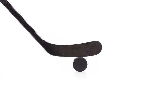 Hockey stick and puck — Stock Photo, Image