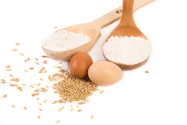 Wood spoon with eggs — Stock Photo, Image