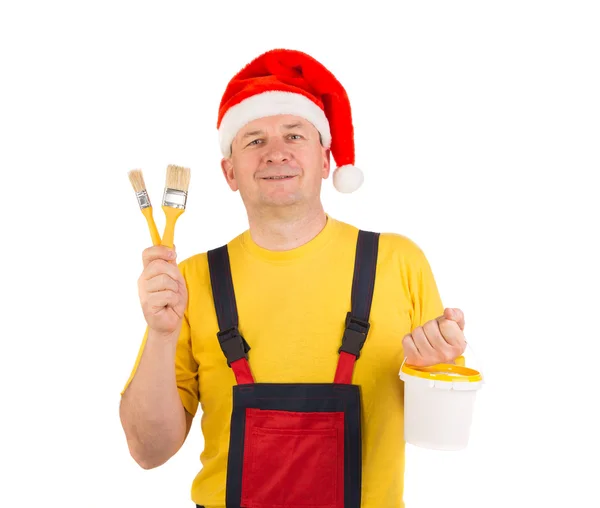 Worker shows brushes. — Stock Photo, Image