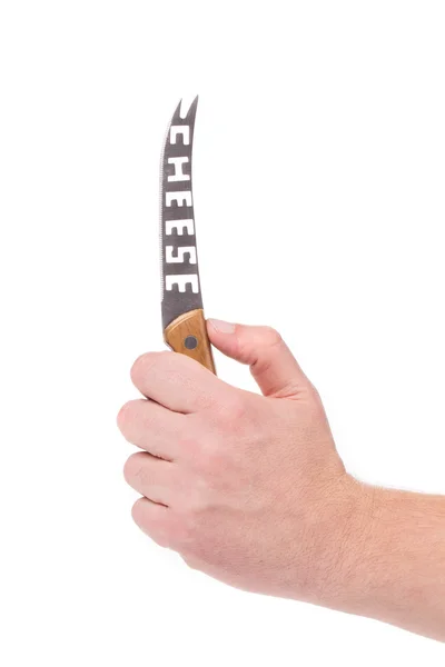 Hand holds cheese knife. — Stock Photo, Image