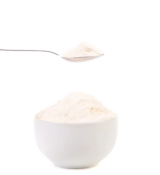 Spoon and bowl with flour. — Stock Photo, Image