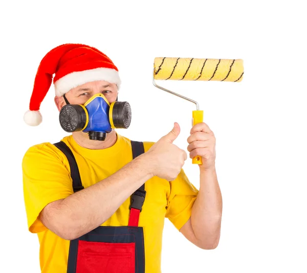 Operaio in maschera antigas e cappello da Babbo Natale — Foto Stock