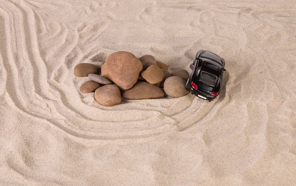 Black racing car on the sand. — Stock Photo, Image