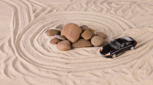 Black racing car on the sand. — Stock Photo, Image