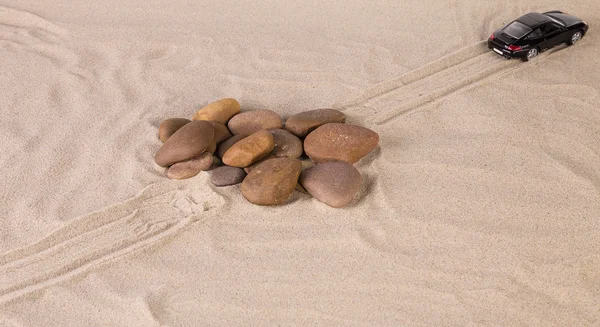 Black racing car on the sand. — Stock Photo, Image