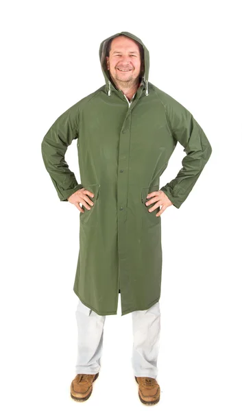 Yağmur yeşil uzun paltolu adam. — Stok fotoğraf