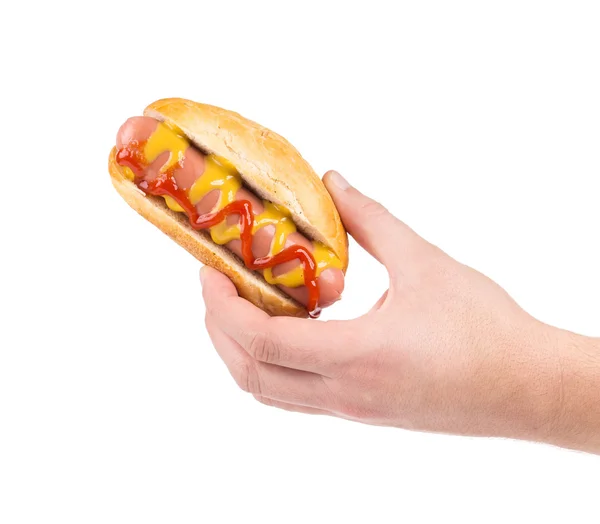 Hand holding hot dog. — Stock Photo, Image