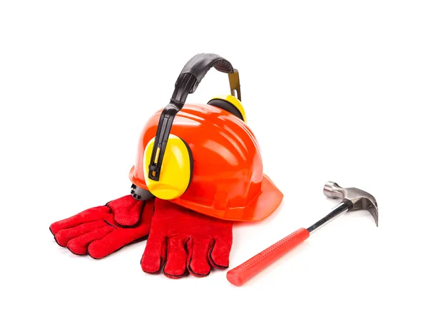 Helmet with gloves, earphones and hammer — Stock Photo, Image