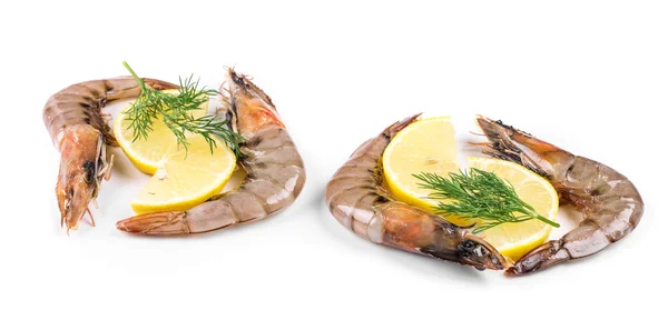 Raw shrimps on plate with lemon. — Stock Photo, Image