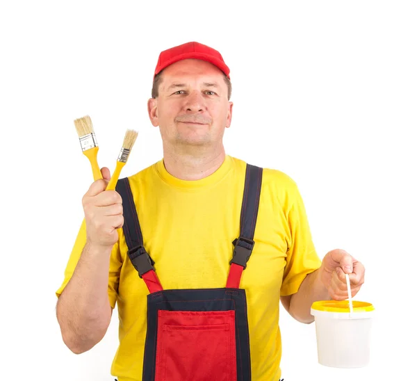 Trabajador mostrando pinceles . — Foto de Stock