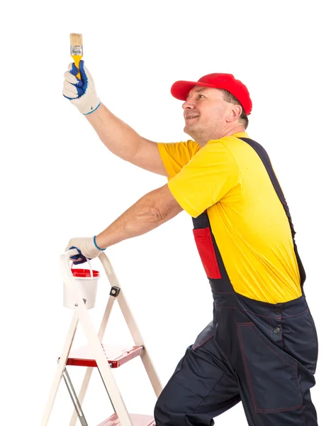 Werknemer op ladder met borstel. — Stockfoto