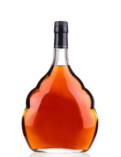 Cognac fles op witte achtergrond. — Stockfoto